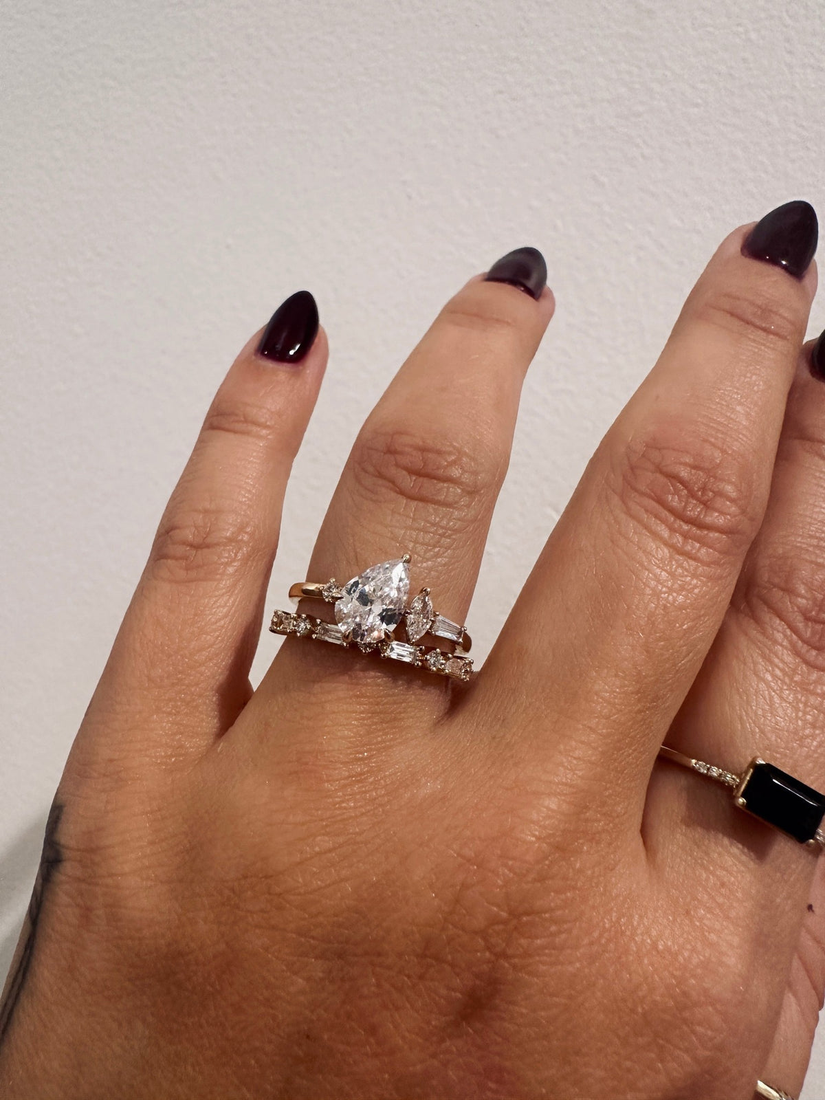 Golden Dusk Wedding Band bridal stack with pear engagement ring