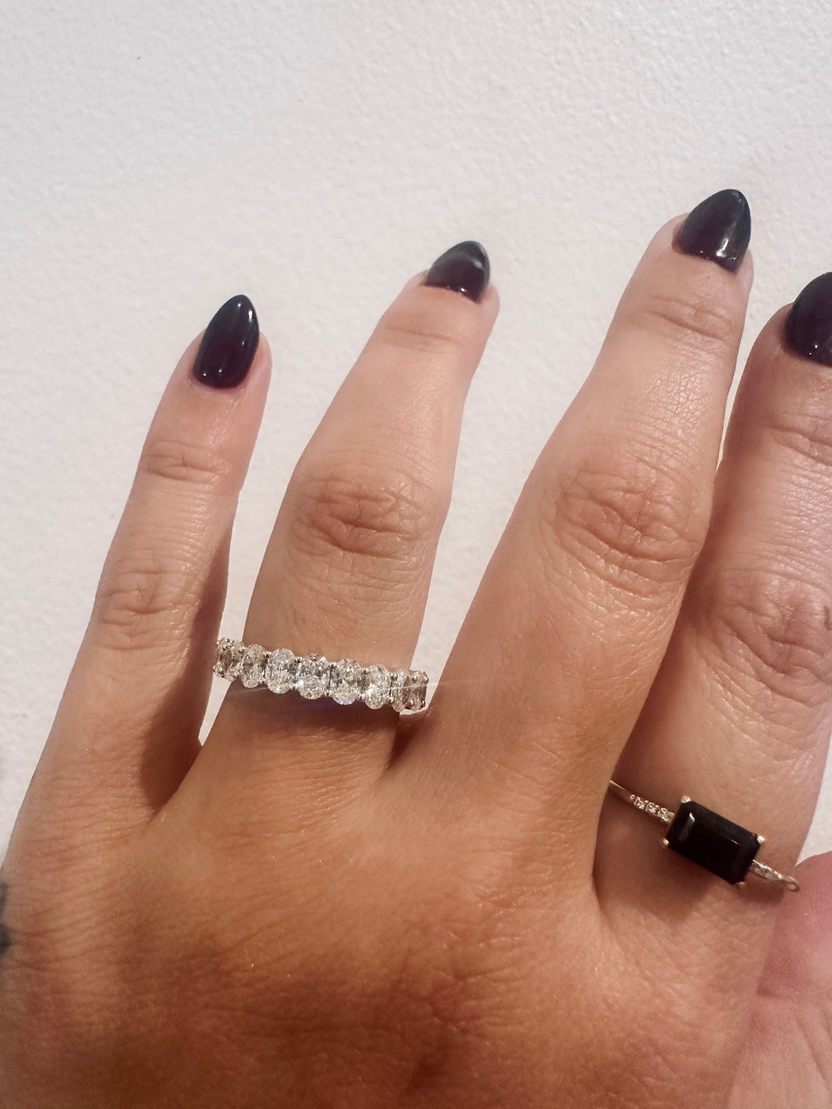 Oval Diamond Devotion Wedding Band with eleven oval diamonds worn on hand
