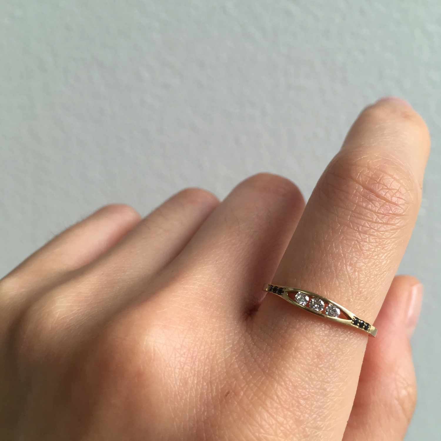 WHITE DIAMOND FLOAT RING WITH BLACK DIAMONDS