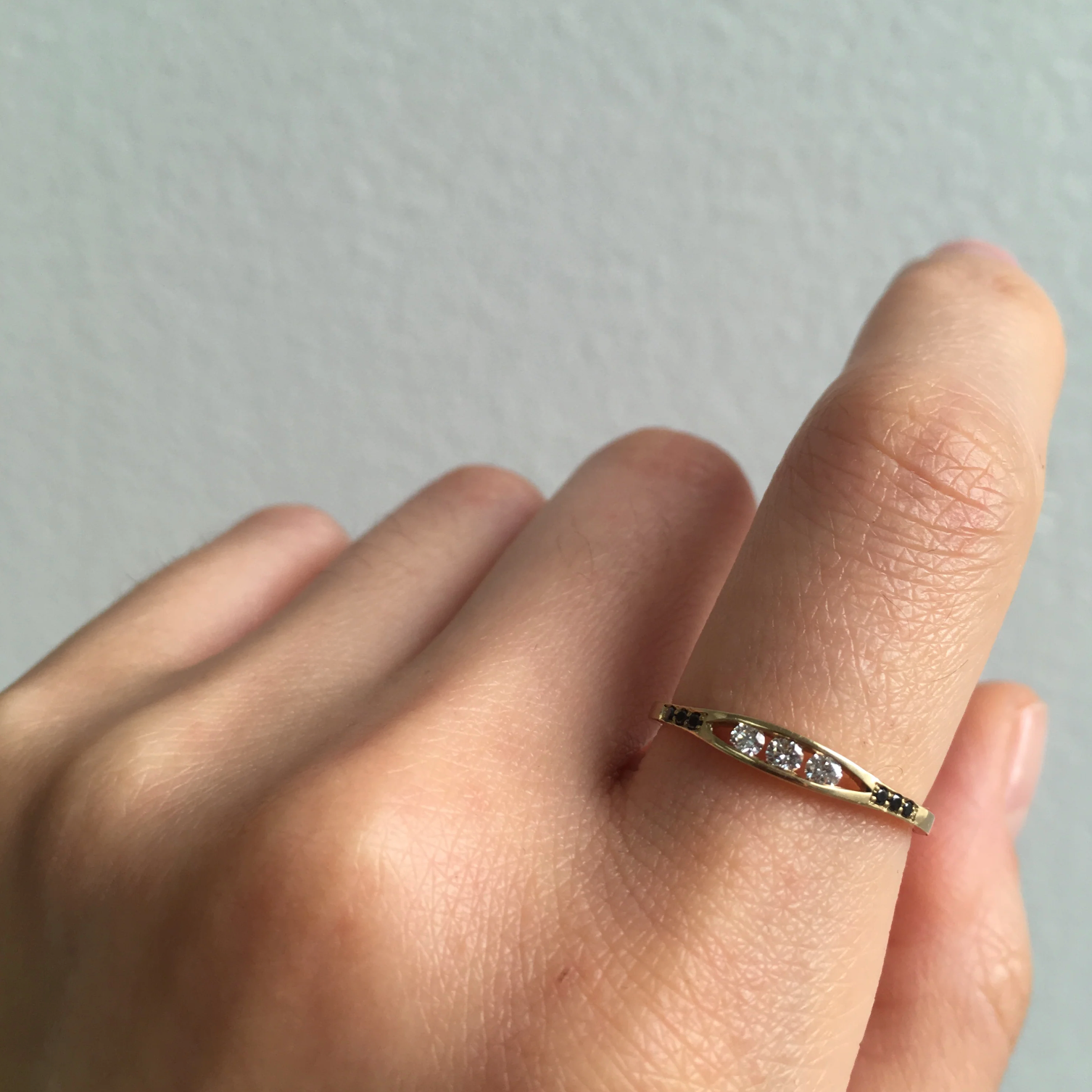 WHITE DIAMOND FLOAT RING WITH BLACK DIAMONDS