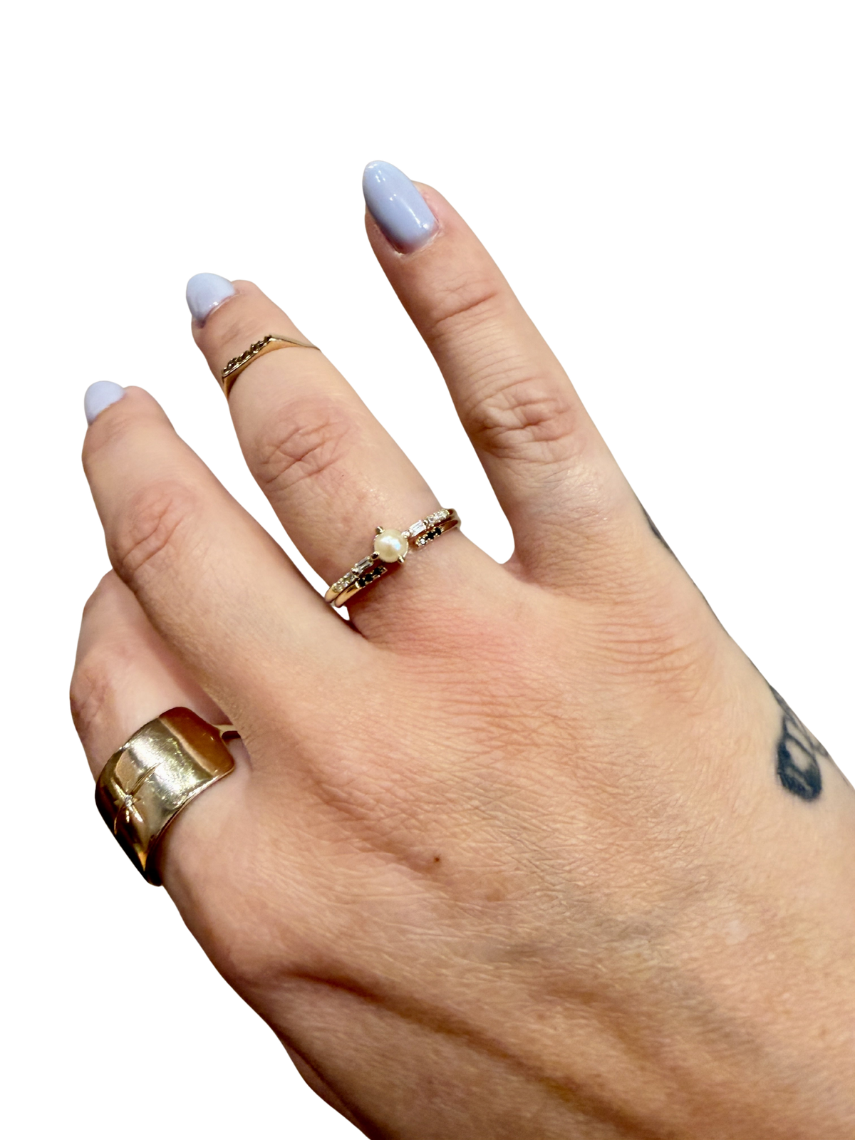 Black Equilibrium Cuff ring by Jennie Kwon with black diamonds, worn stacked on the hand