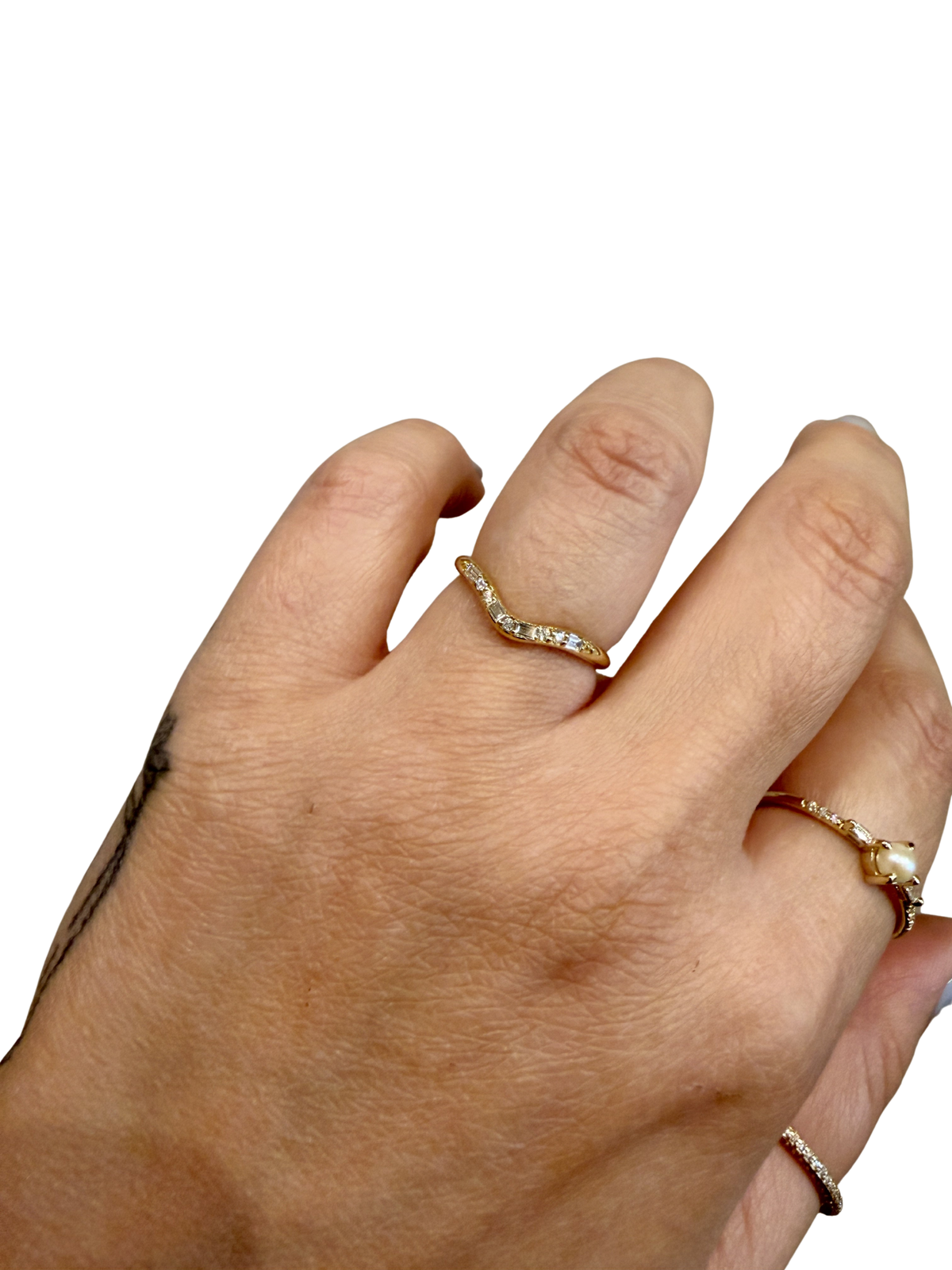 Diamond Staccato Wave Band by Jennie Kwon, baguette and round diamonds worn on the hand
