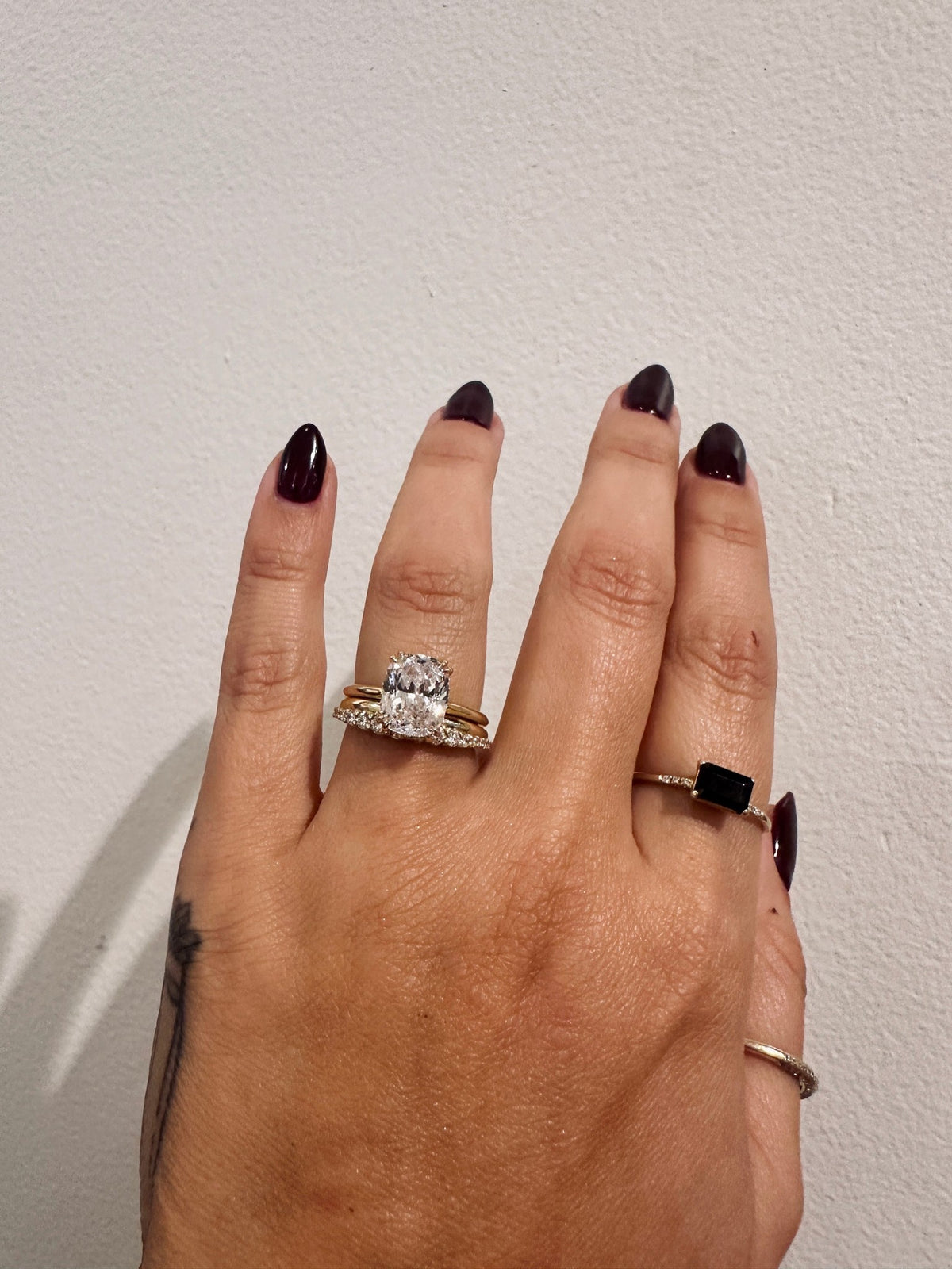 Golden Dawns wedding band in 14kt yellow gold with graduated round diamonds worn on the hand