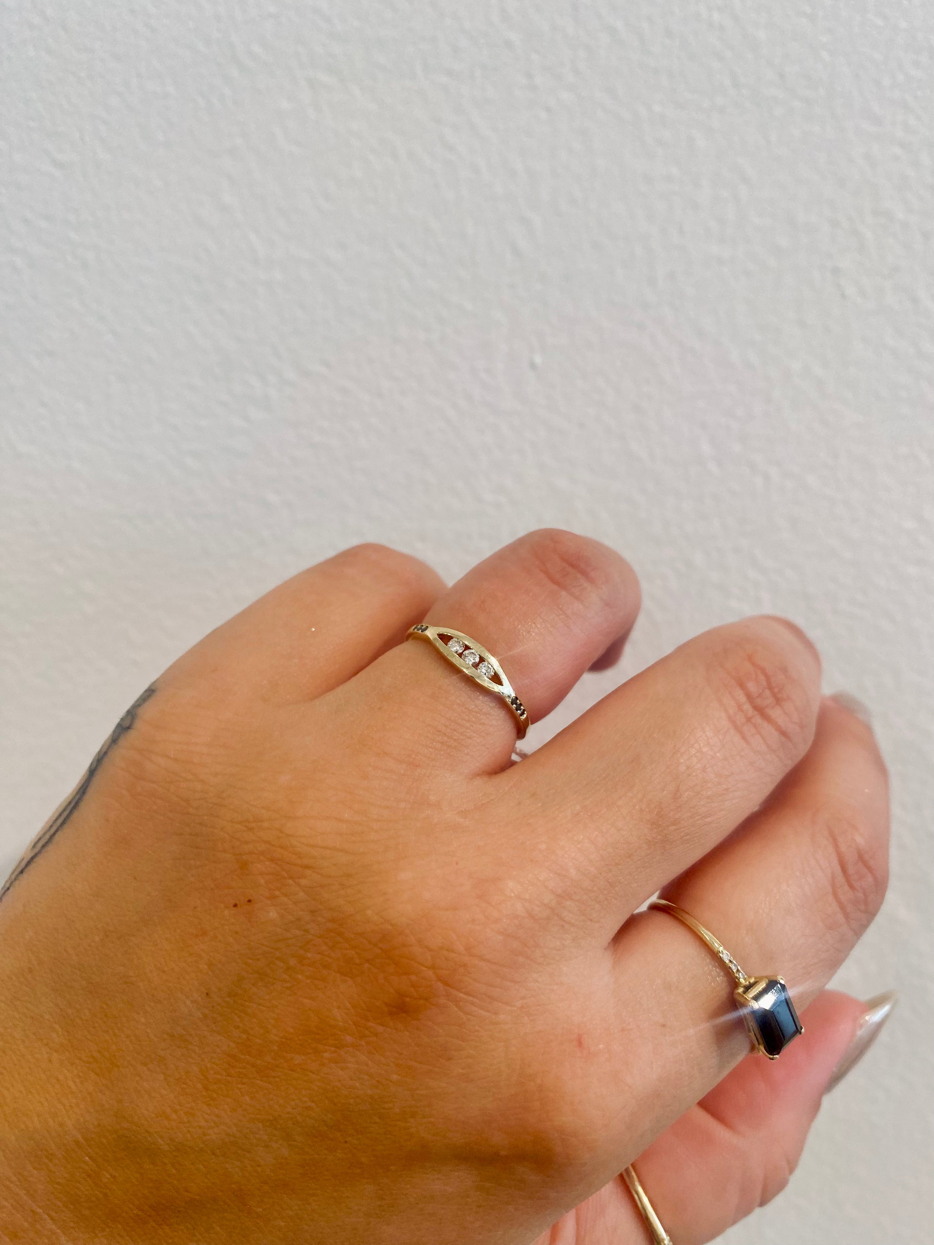 WHITE DIAMOND FLOAT RING WITH BLACK DIAMONDS