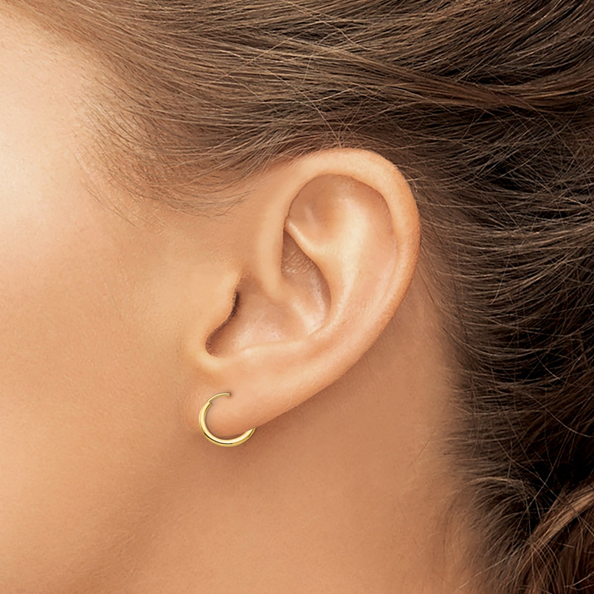 Endless Universe Hoops in 14kt yellow gold worn on model, smallest size shown