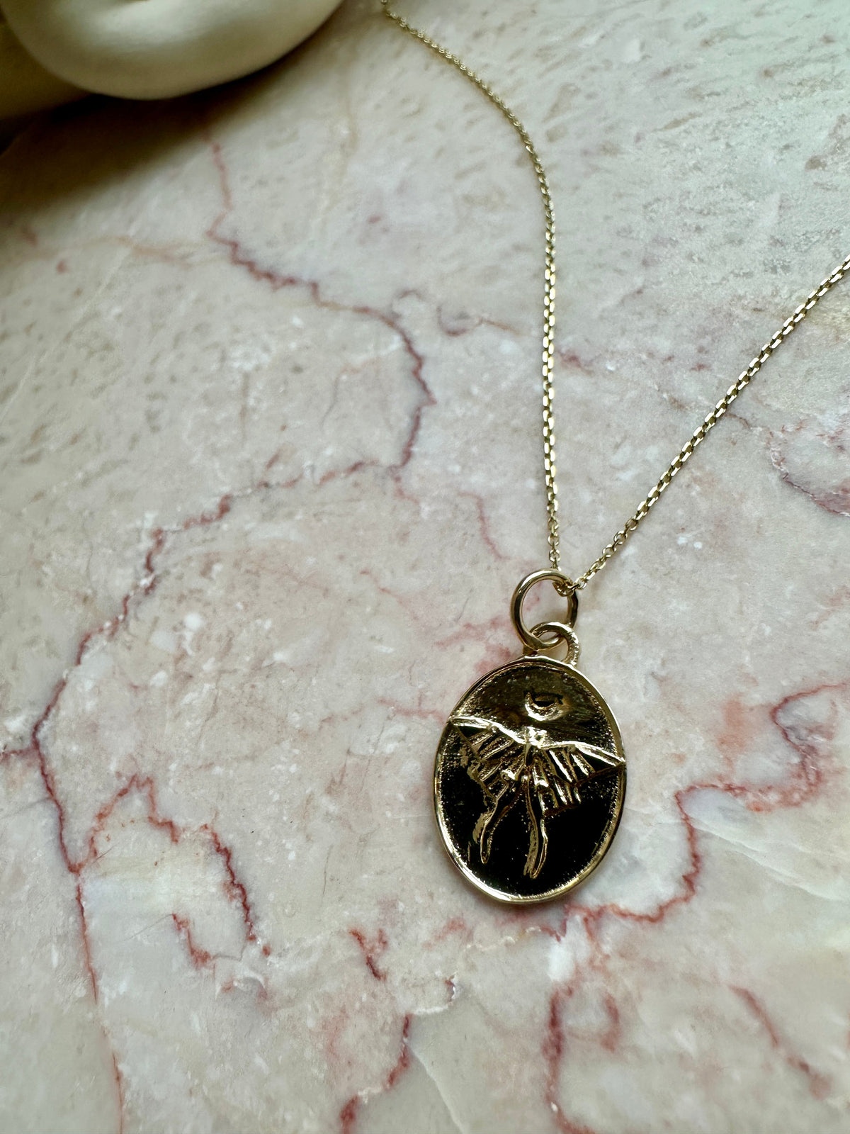 Dusk To Dawn Luna Moth Pendant worn on chain