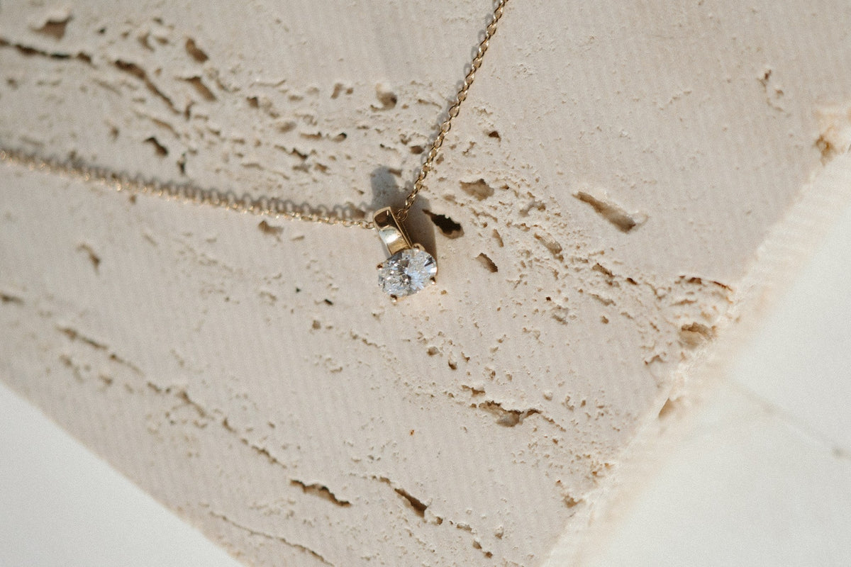 Oval Prism Necklace on travertine stone