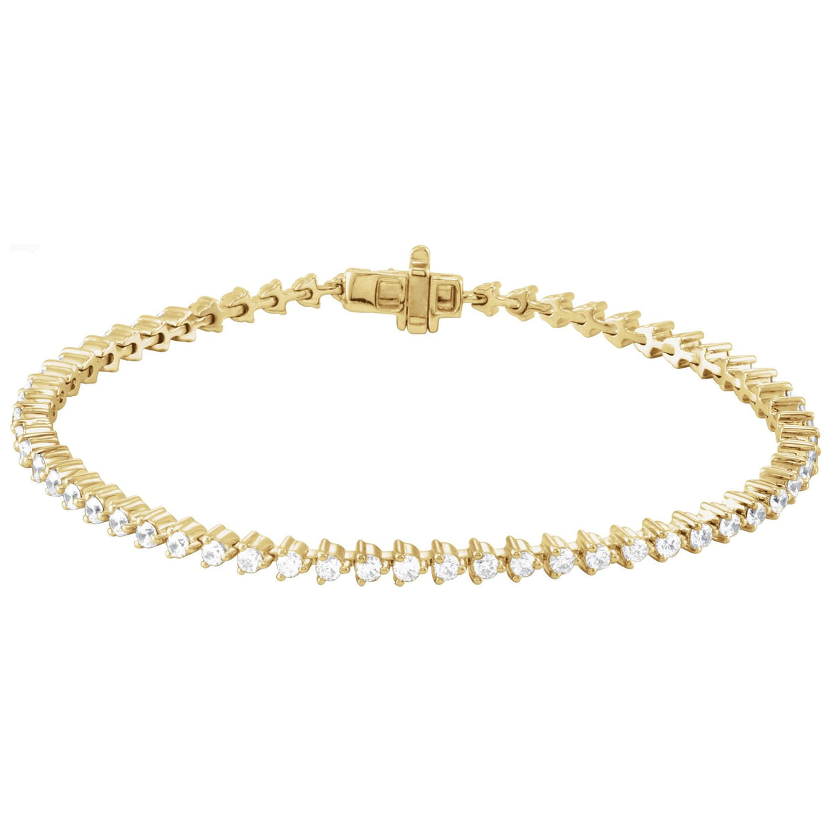 The Playful Tennis Bracelet in 14kt yellow gold with three prong round diamonds