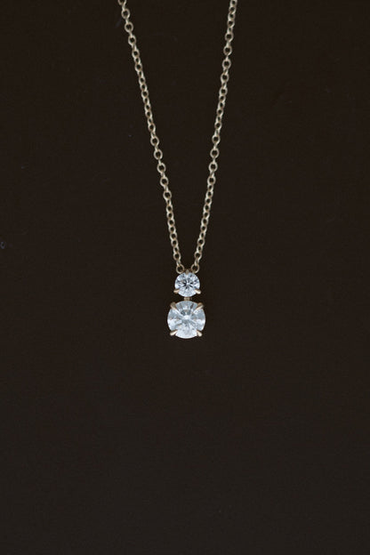 Diamond Horizon Pendant, two diamond necklace in 14kt yellow gold on a dark background