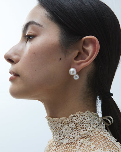 Pearl Clove Earrings worn on the ear, side profile