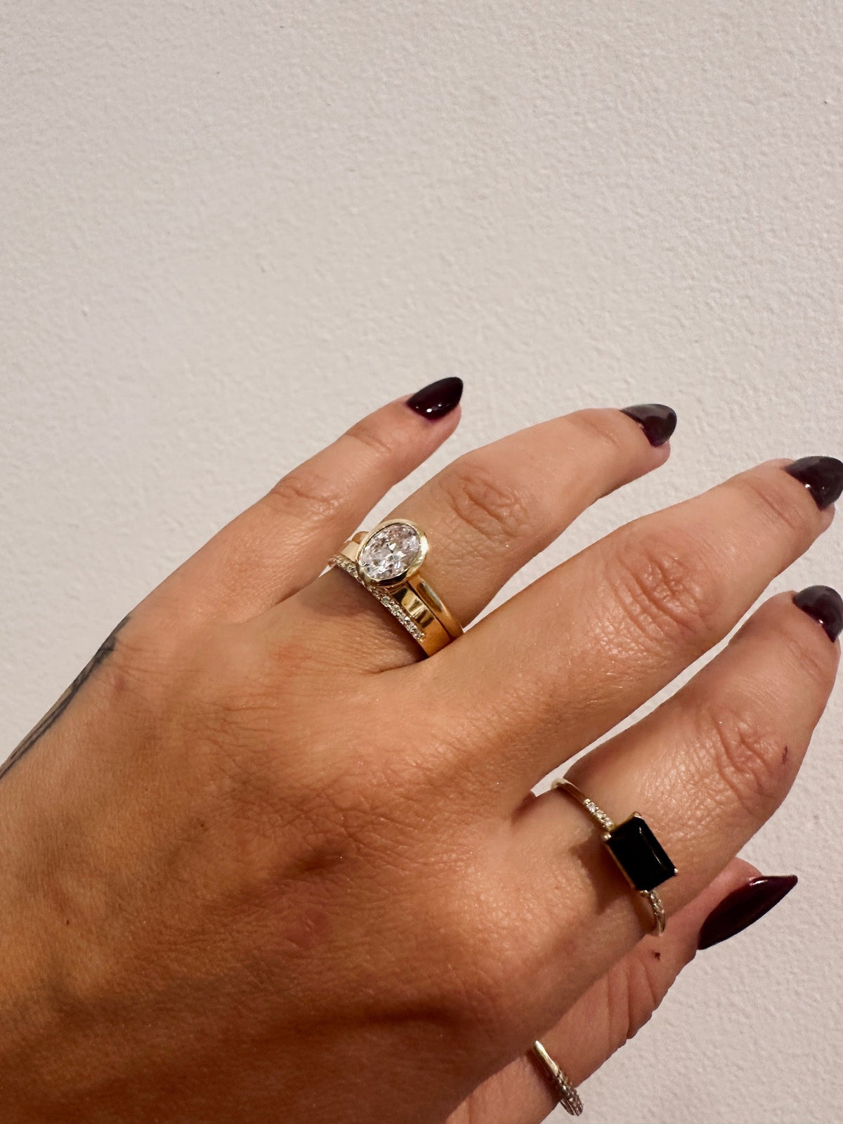 Cigar Glamour Wedding Band stacked with a diamond engagement ring
