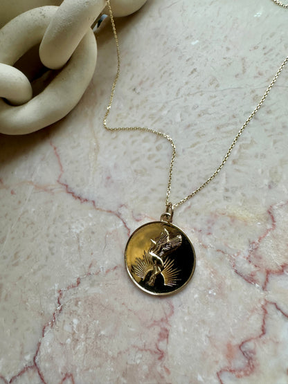 Sunrise Crane Medallion worn on chain