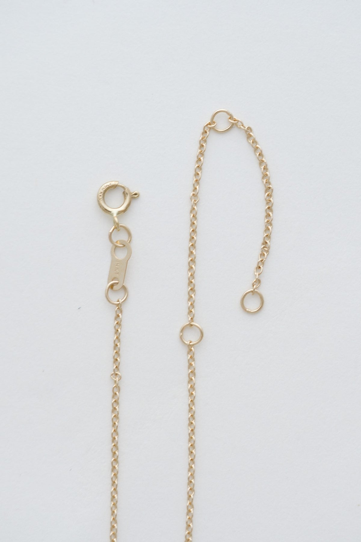 Dainty Cable Charm Chain in 14kt yellow gold with spring ring clasp and adjustable length rings