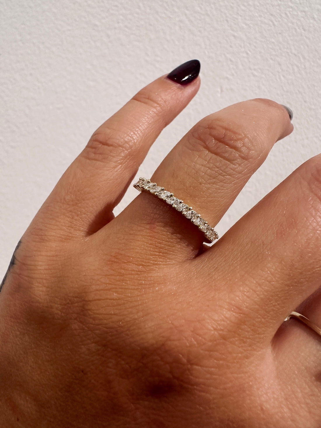 BB Marquise Eros wedding band in 14kt yellow gold with prong set marquise diamonds worn on the hand
