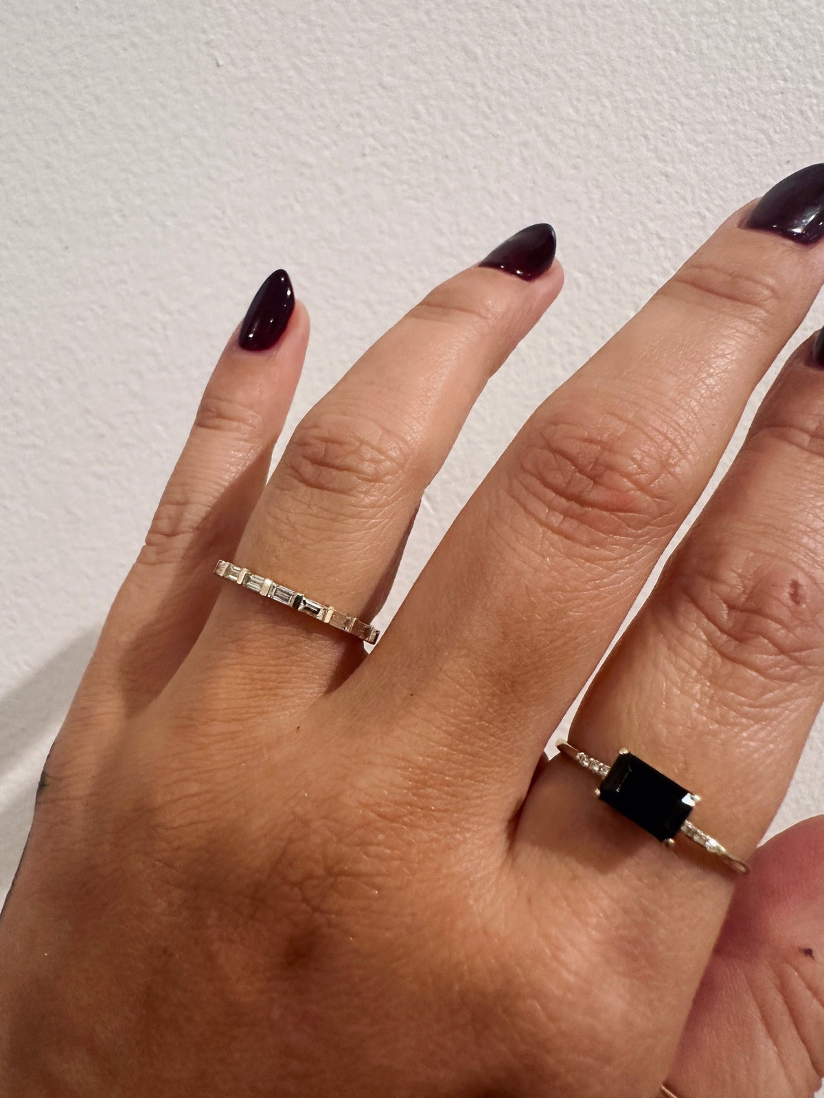 Baguette Sol wedding band in 14kt yellow gold with baguette diamonds worn on the hand