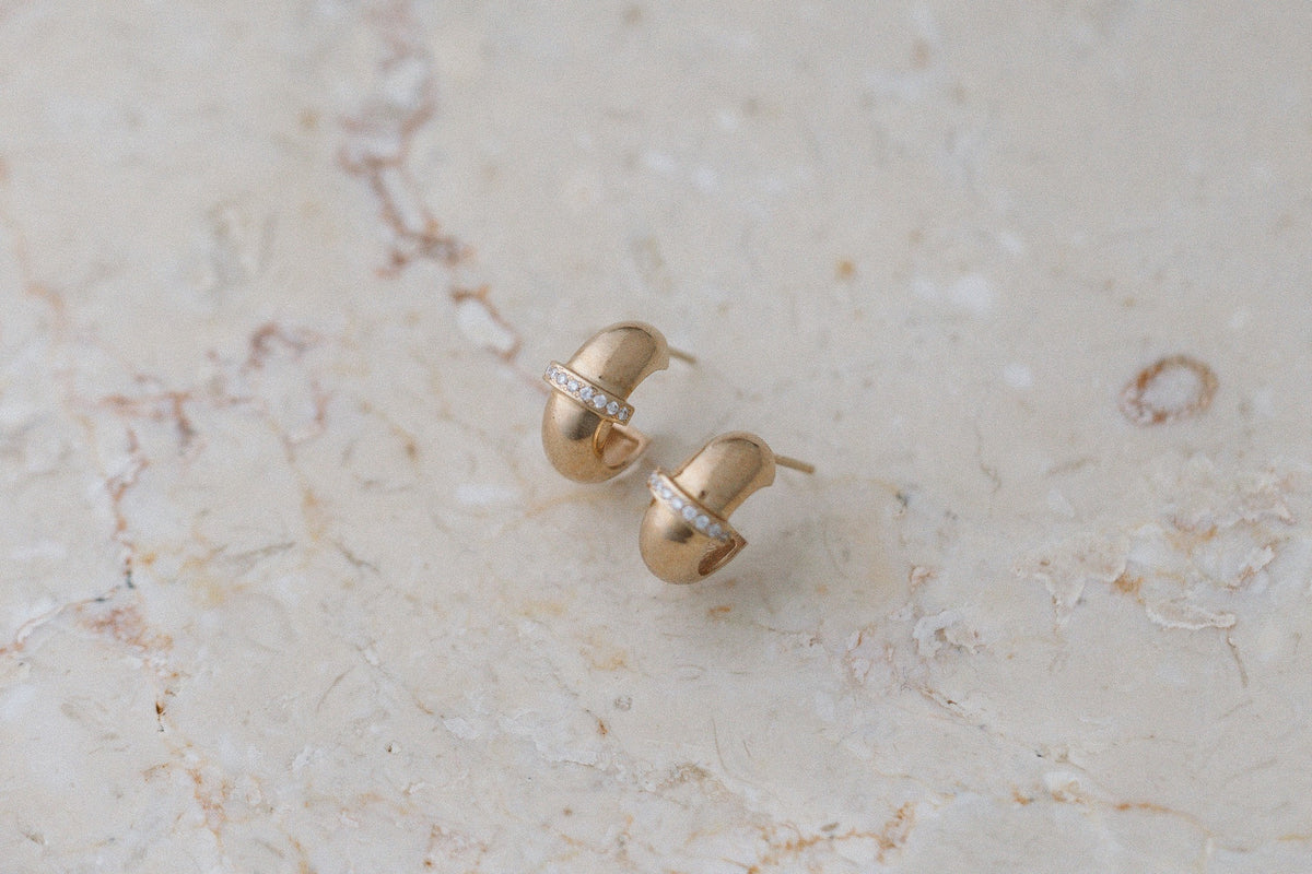 Diamond Row Chubby Huggies by Zoe Chicco in 14kt yellow gold, on marble