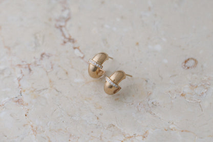 Diamond Row Chubby Huggies by Zoe Chicco in 14kt yellow gold, on marble