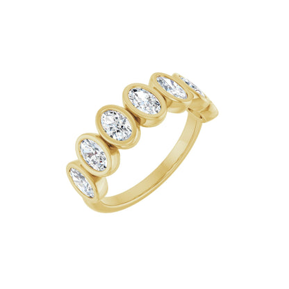 Oval Demur wedding band in 14kt yellow gold with bezel set oval diamonds, perspective view