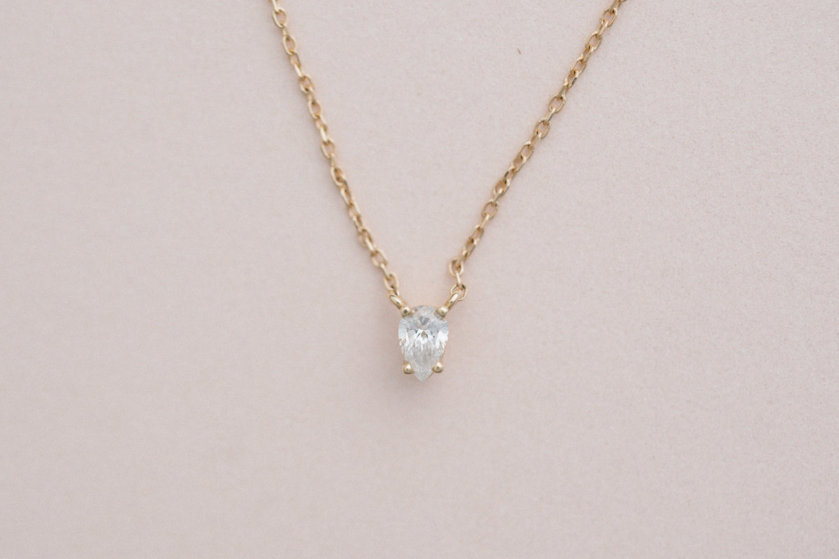 Tear of Cupid Pendant, pear diamond necklace in 14kt yellow gold on blush