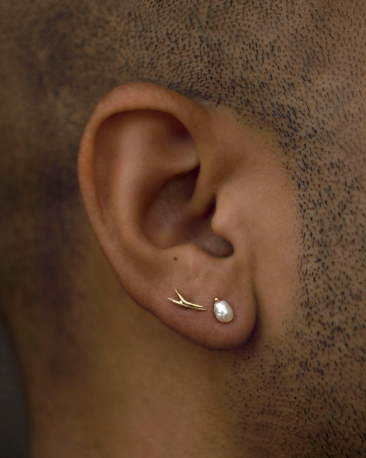 Irregular Pearl Earrings worn on the ear