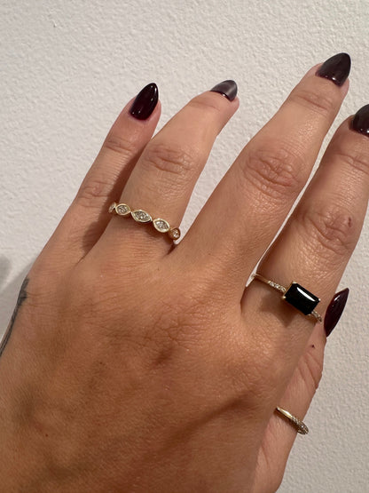 Marquise Ambitions wedding band in 14kt yellow gold with bezel set marquise diamonds worn on the hand