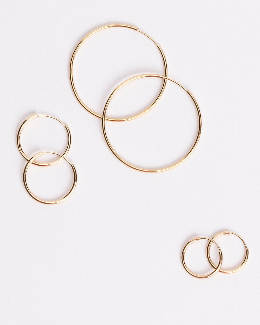 Endless Universe Hoops in 14kt yellow gold