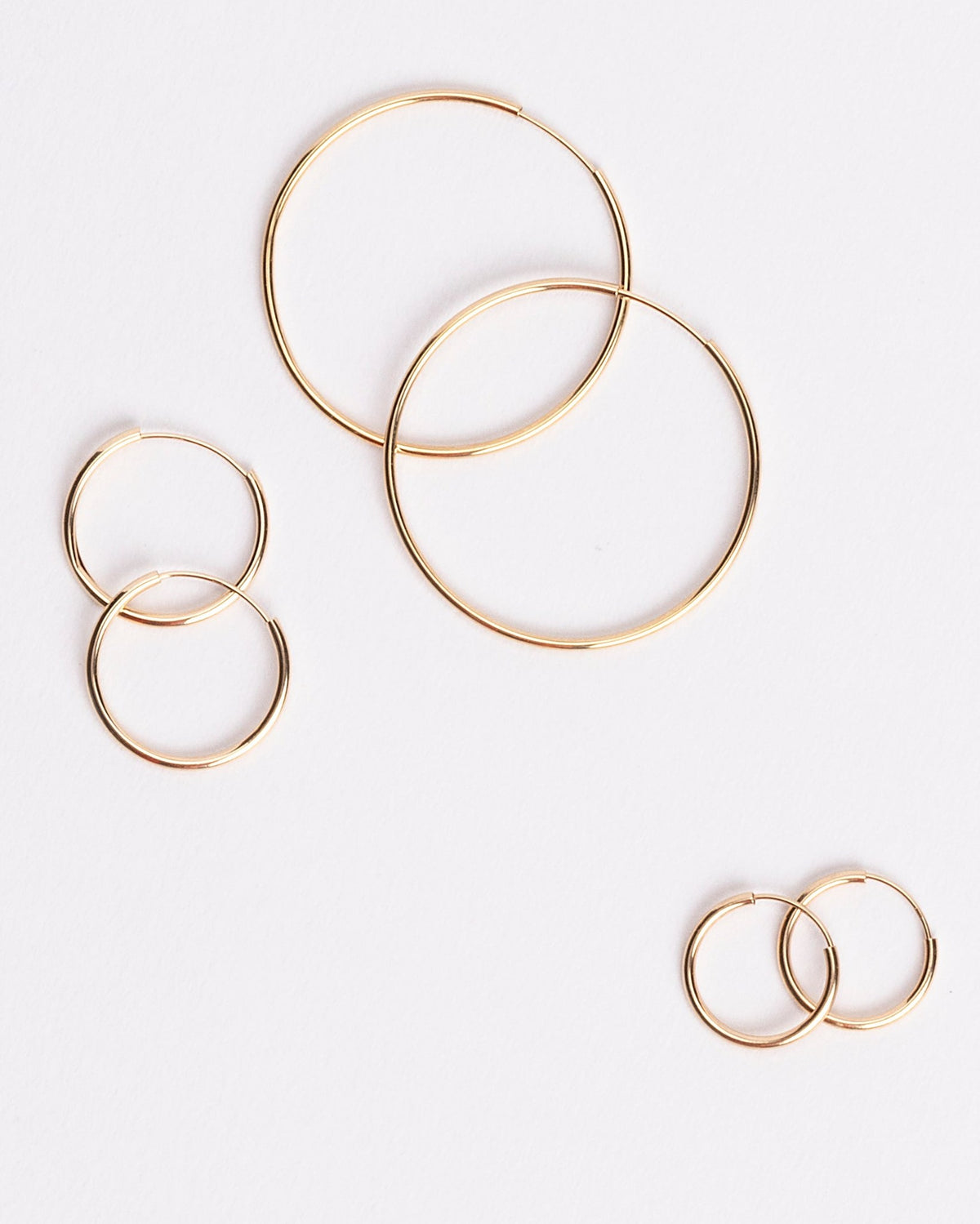 Endless Universe Hoops in 14kt yellow gold