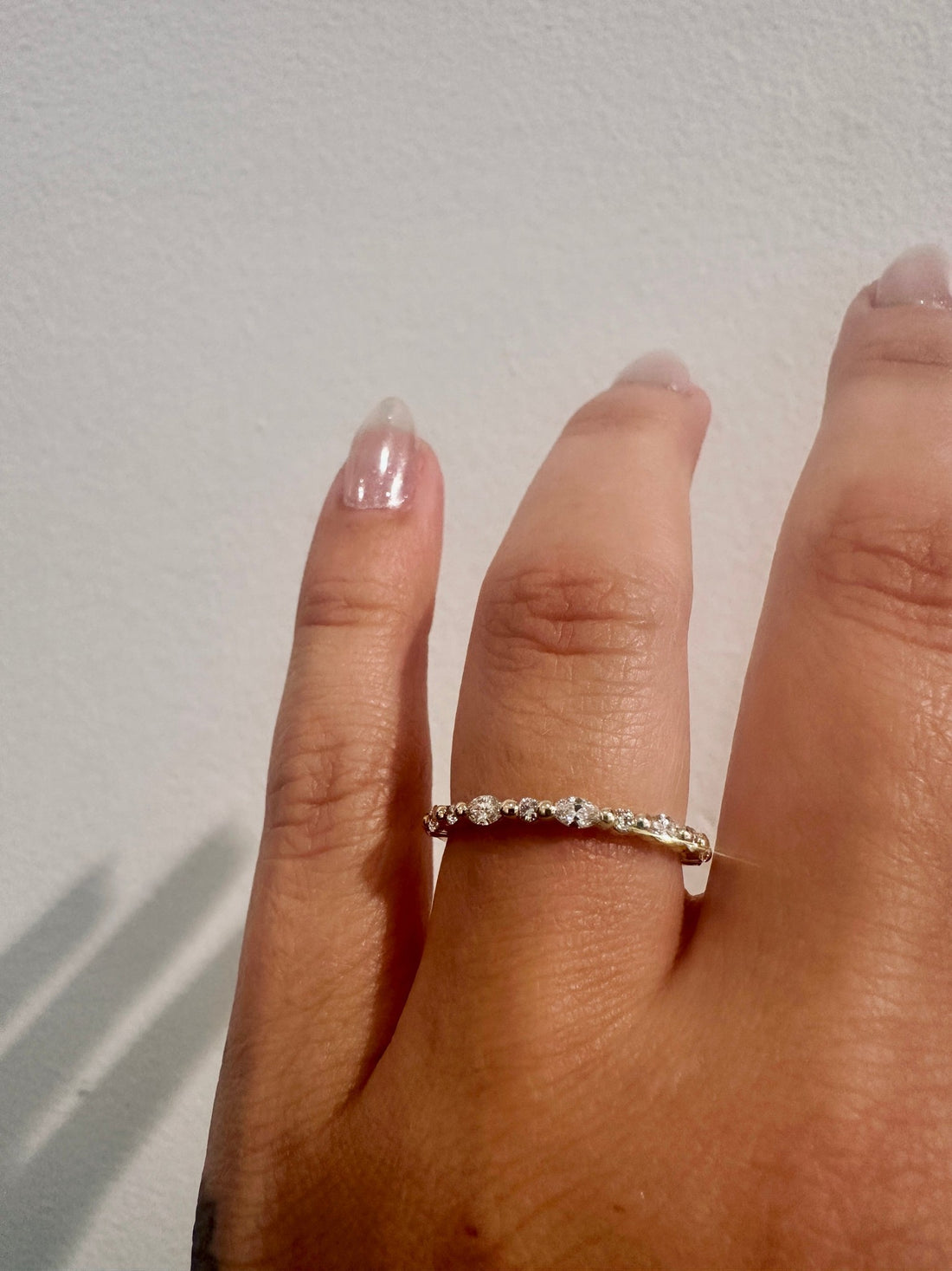 Marquise Diamond Showers wedding band in 14kt yellow gold with marquise and round diamonds worn on the hand