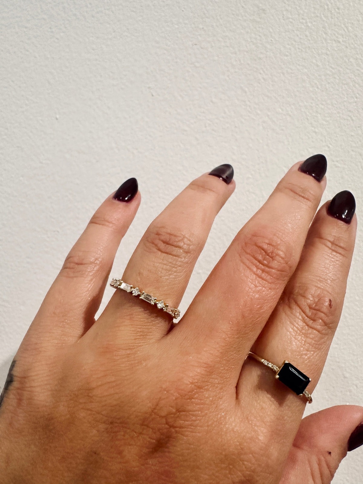 Golden Dusk baguette and round diamond wedding band in 14kt gold on hand