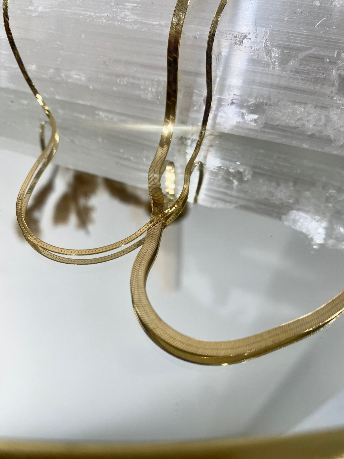 BB Herringbone Chain draped over selenite in a gold dish