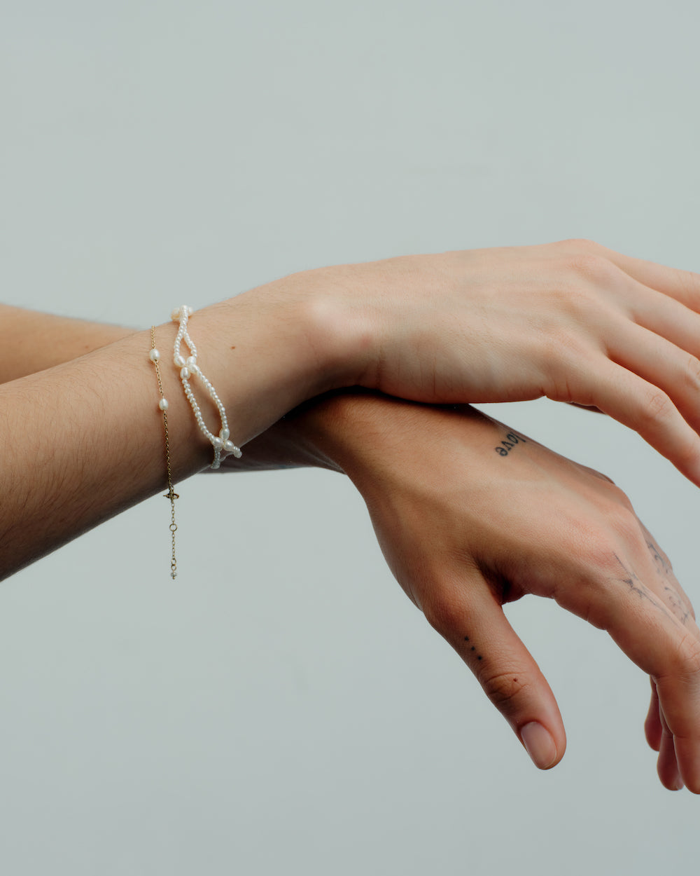 Pearl Petal Bracelet layered on the wrist