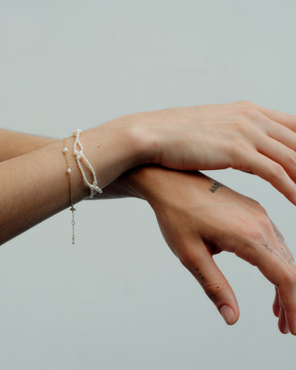 Pearl Petal Bracelet layered on the wrist