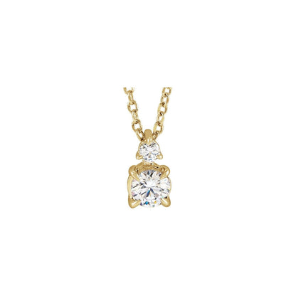 14kt yellow gold claw prong lab grown diamond pendant with a petite diamond above, front view