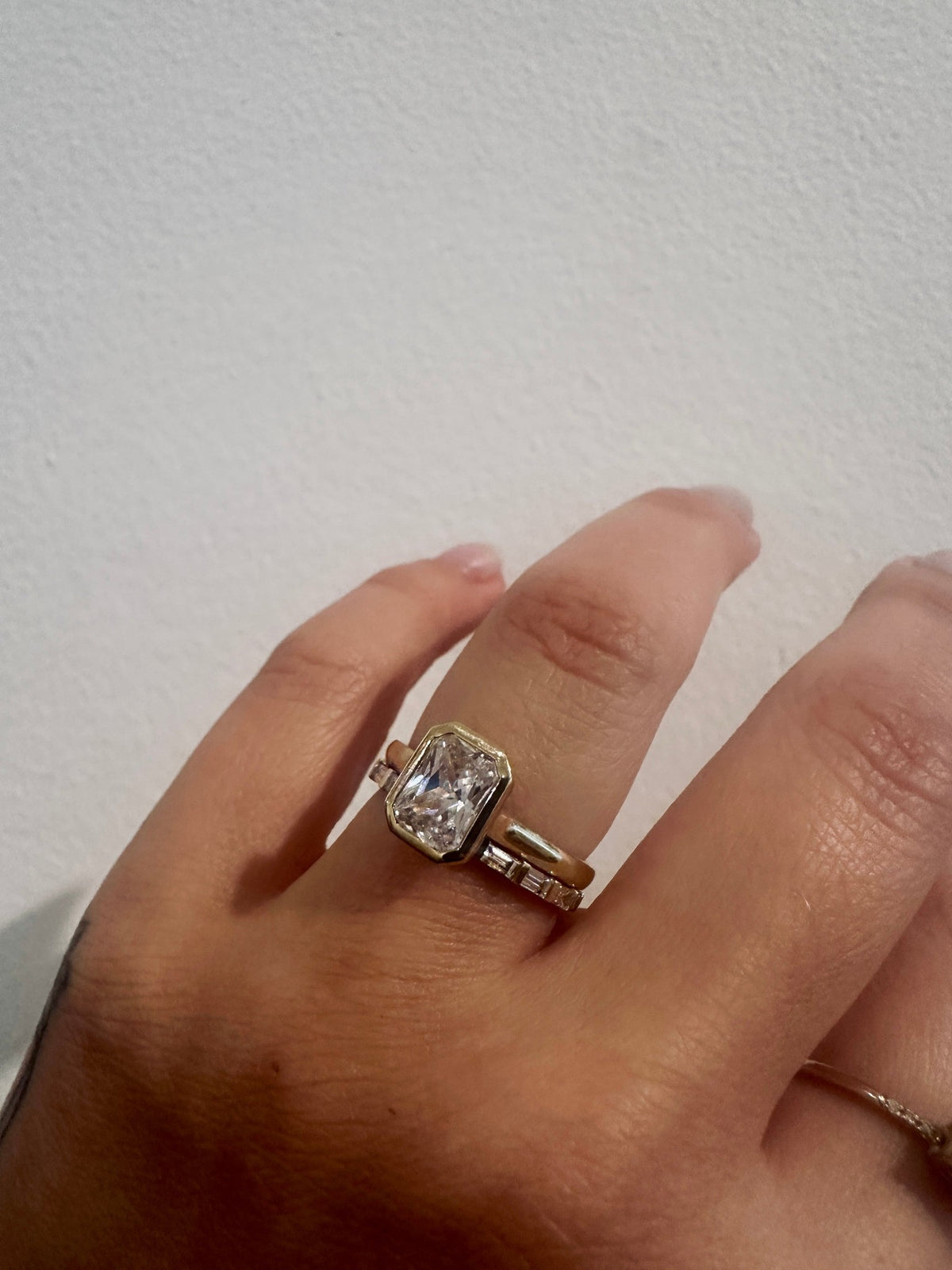 Baguette Sol wedding band in 14kt yellow gold with baguette diamonds worn on the hand