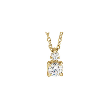 14kt yellow gold claw prong lab grown diamond pendant with a petite diamond above, front view