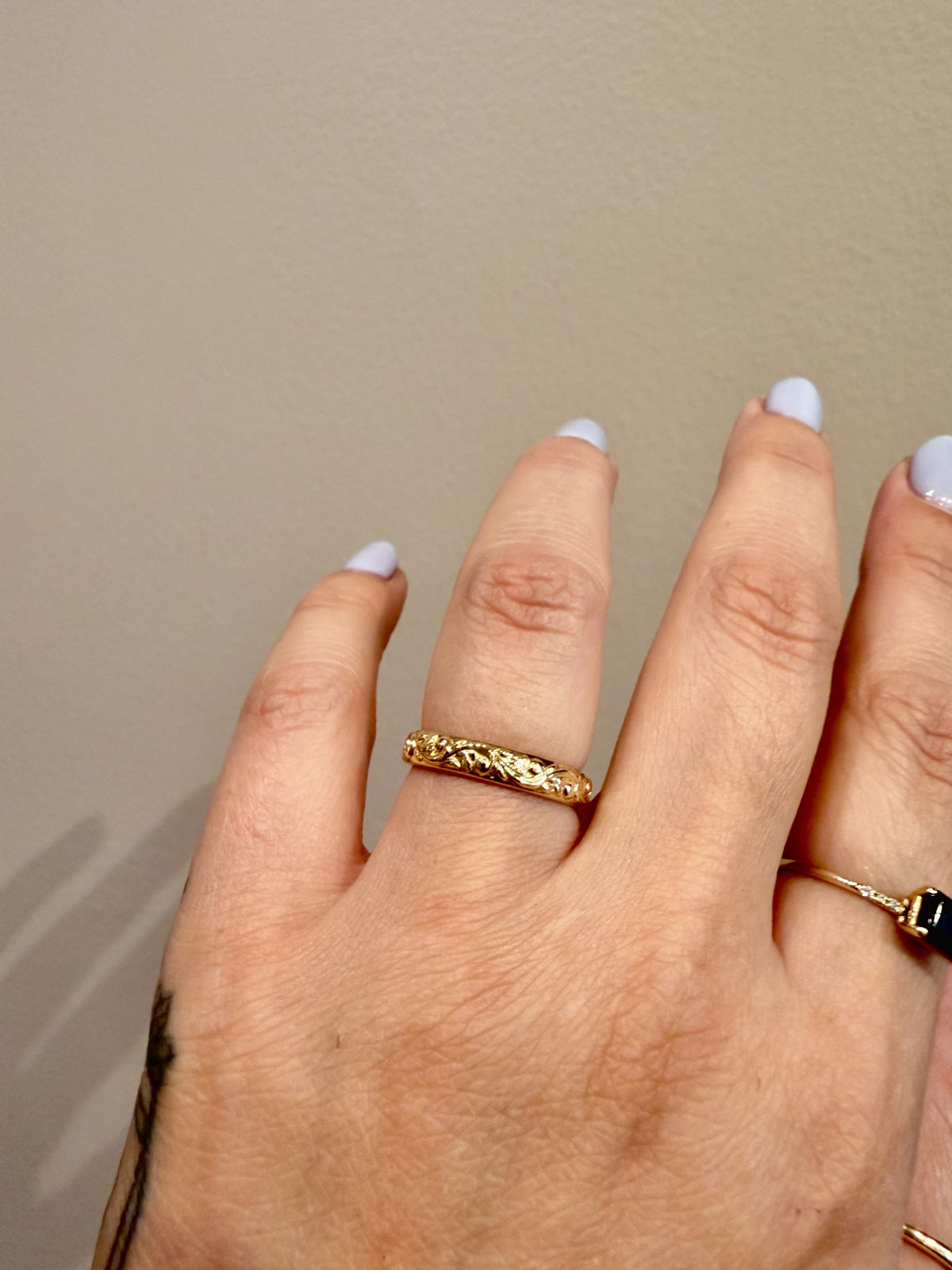 Golden Floral Band sculpted floral band in 14kt yellow gold worn on the hand