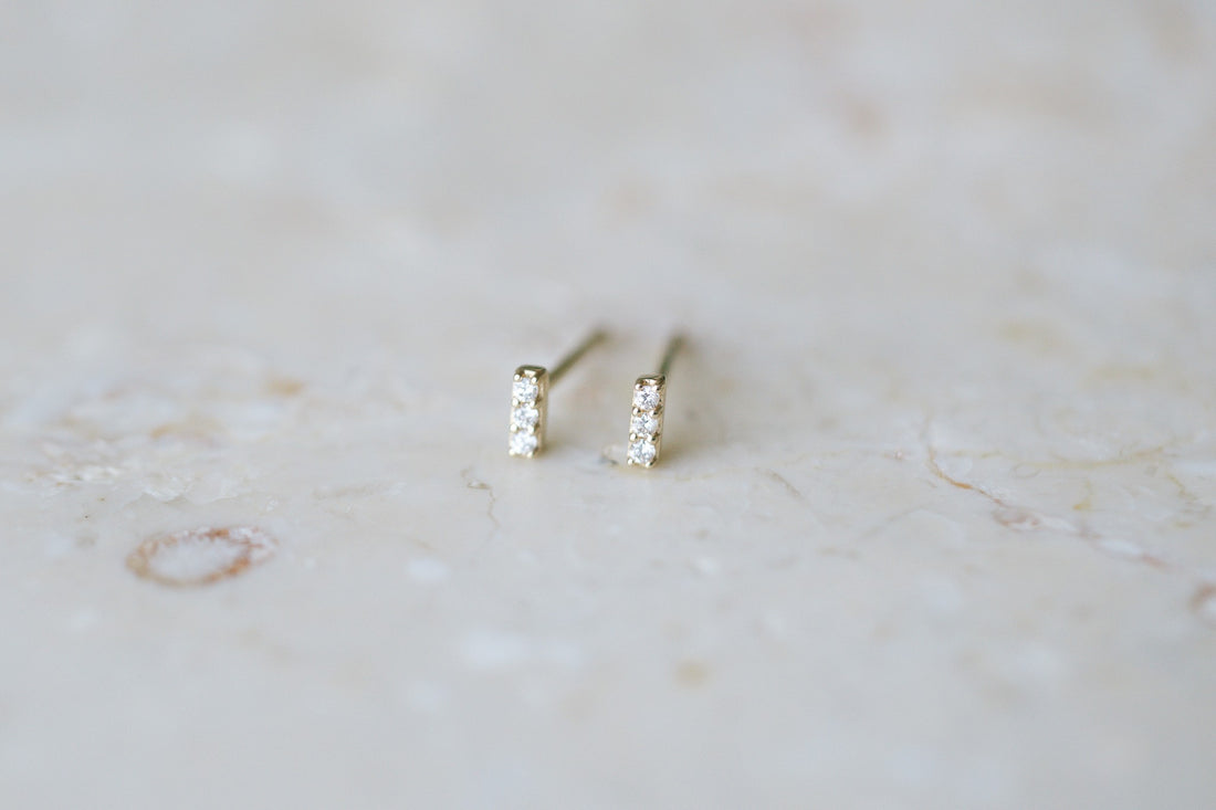 BB Three Diamond Bars, 14kt yellow gold bar studs with three natural diamonds on stone