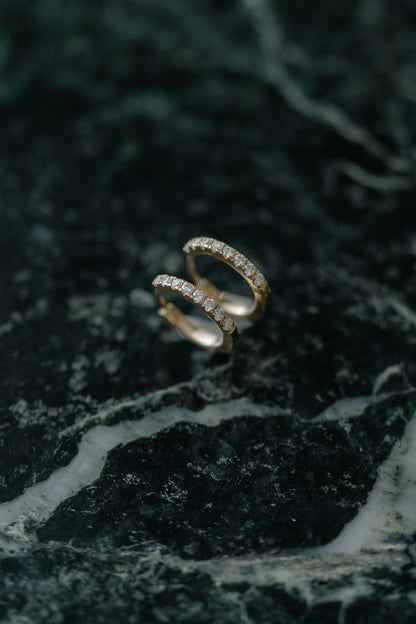 BB Classic Diamond Huggies by Lane &amp; Kate in 14kt yellow gold with a row of diamonds, on green marble