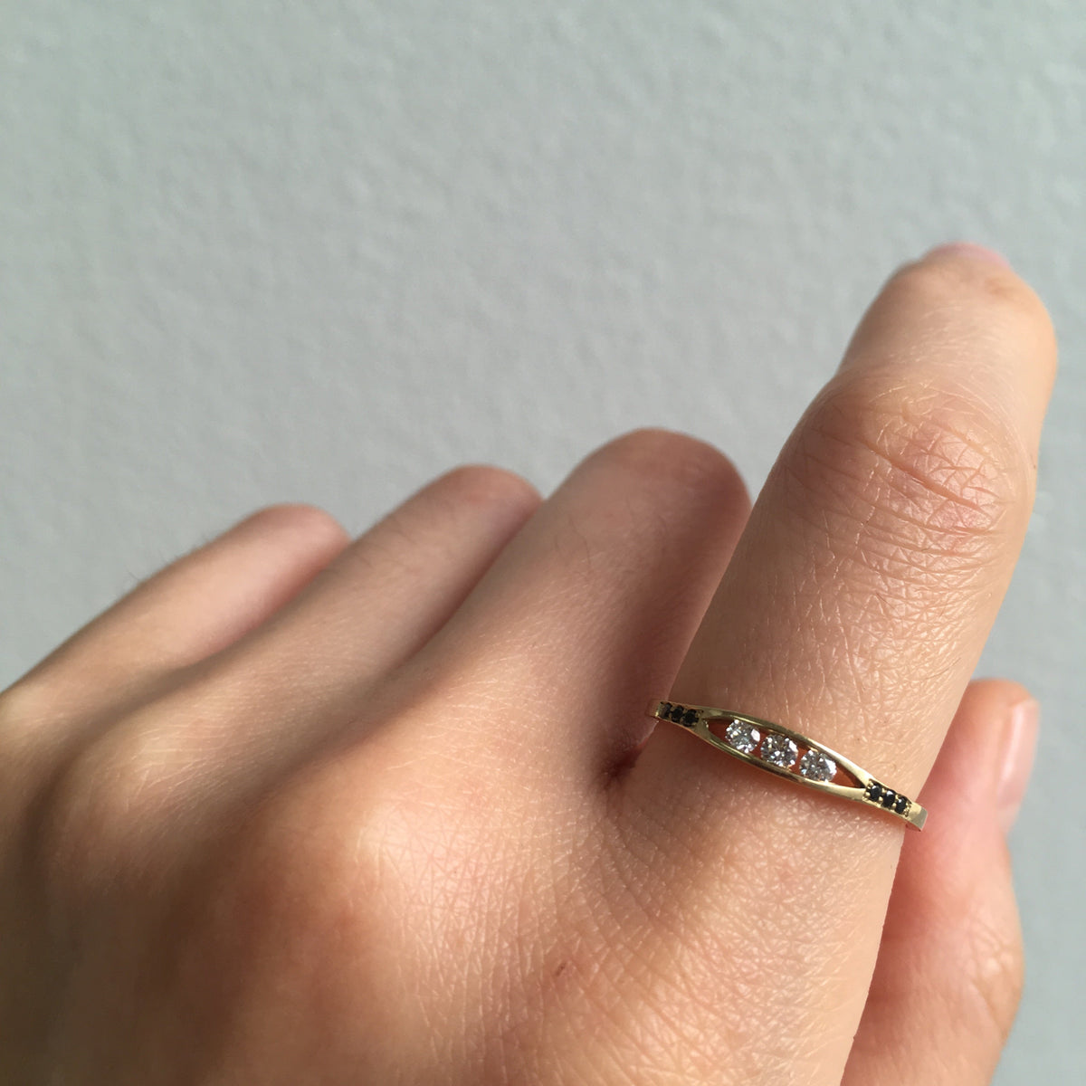 White &amp; Black Diamond Float Ring by Jennie Kwon worn on the hand