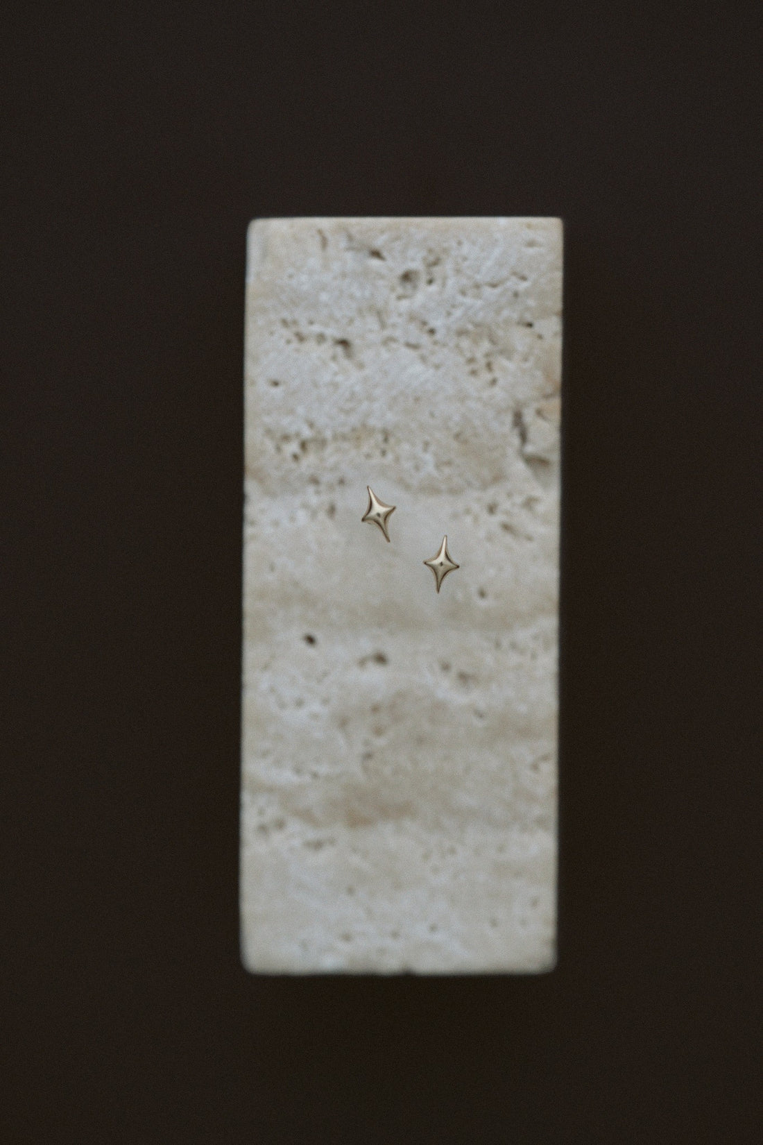 Petite Golden Stars by Lane &amp; Kate, tiny 14kt yellow gold star studs on travertine