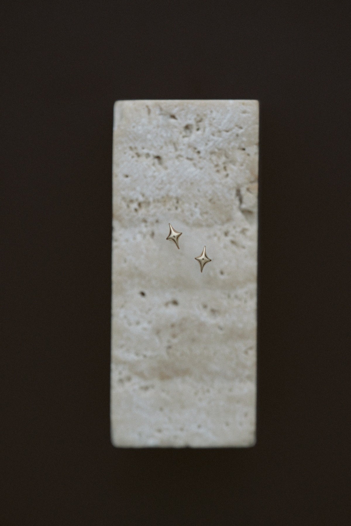 Petite Golden Stars by Lane &amp; Kate, tiny 14kt yellow gold star studs on travertine