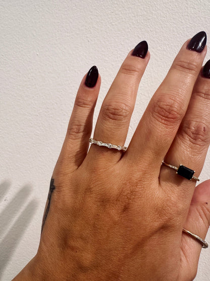 Cora Baguettes wedding band in 14kt yellow gold with baguette and round diamonds worn on the hand