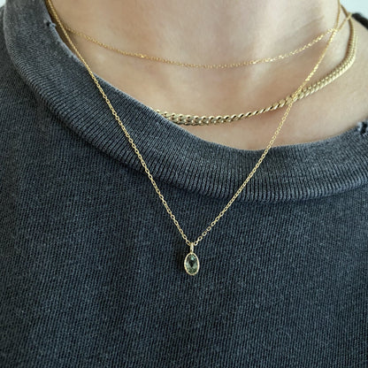 Jennie Kwon Oval Green Sapphire Wisp Necklace styled