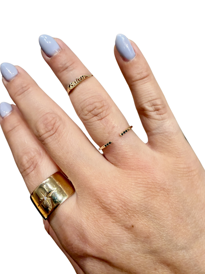 Black Equilibrium Cuff ring by Jennie Kwon with black diamonds, worn on the hand