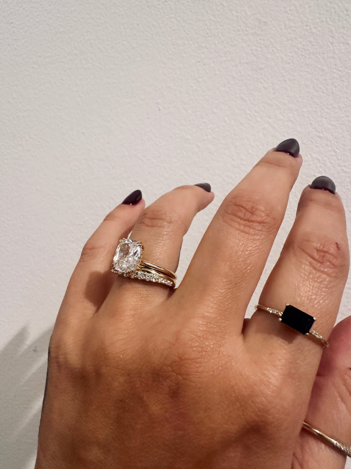 Golden Dawns wedding band in 14kt yellow gold with graduated round diamonds worn on the hand