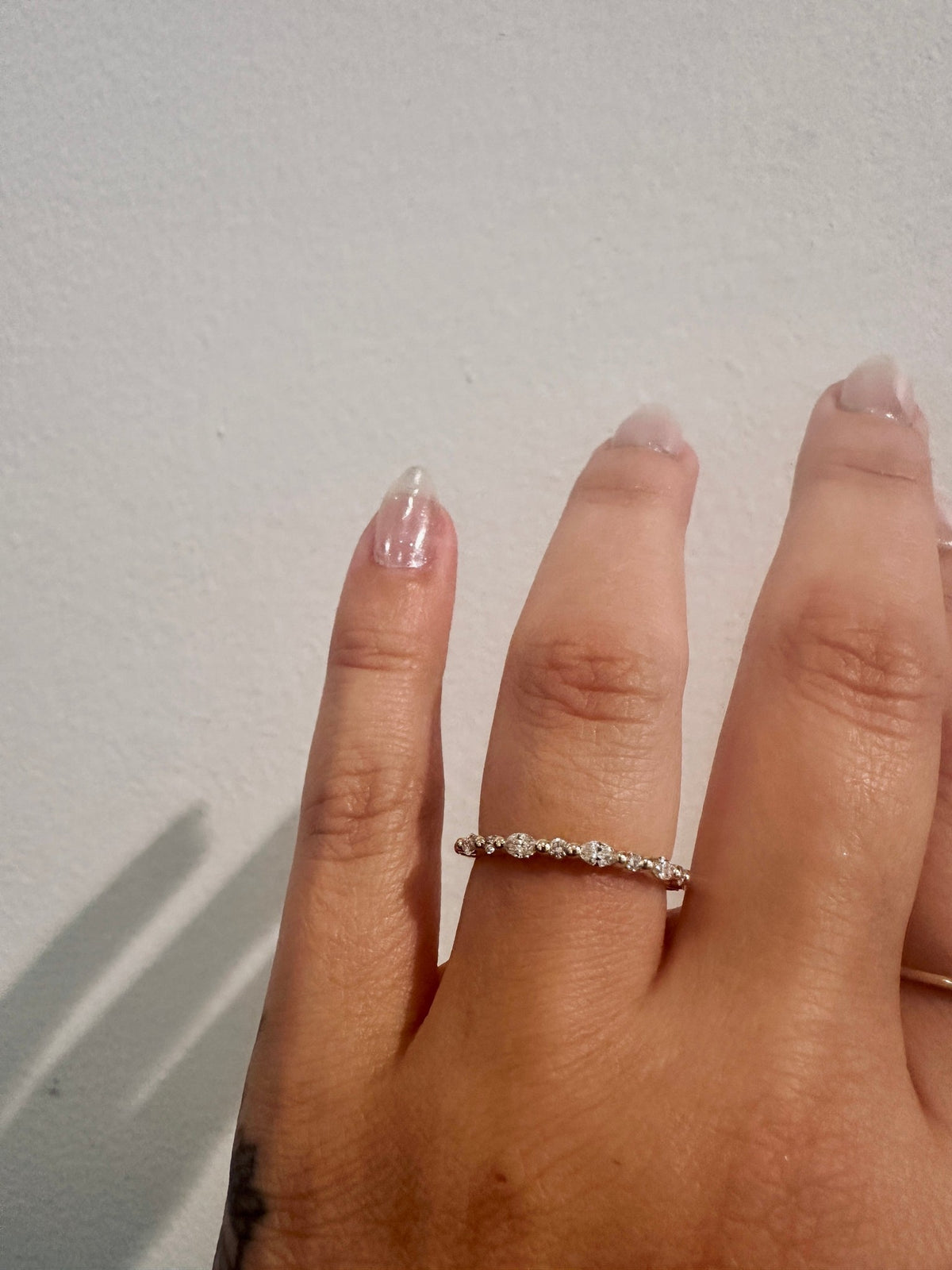 Marquise Diamond Showers wedding band in 14kt yellow gold with marquise and round diamonds worn on the hand