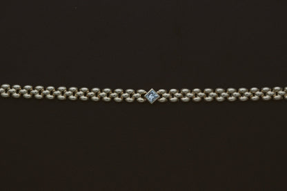 Princess Diamond Panther Bracelet by Zoe Chicco, laid flat showing the princess diamond station