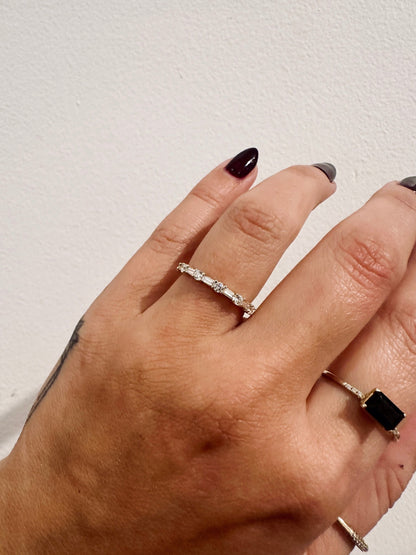 Cora Baguettes wedding band in 14kt yellow gold with baguette and round diamonds worn on the hand