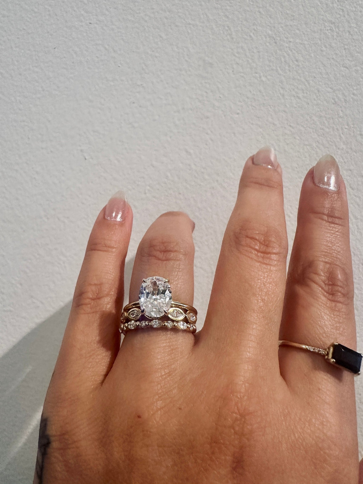 Marquise Ambitions wedding band in 14kt yellow gold with bezel set marquise diamonds worn on the hand