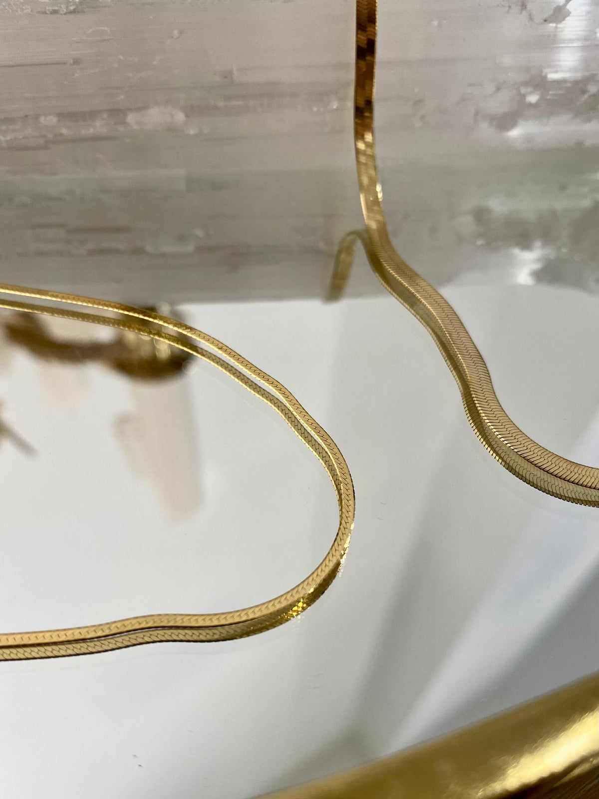 BB Herringbone Chain in 14kt yellow gold styled on selenite